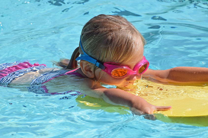Girl on Bodyboard in Swimming Pool Girl on Bodyboard in Swimming Pool